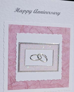 Anniversary - rings on old rose